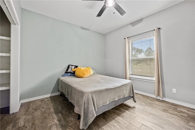 bedroom featuring ceiling fan and wood-type flooring