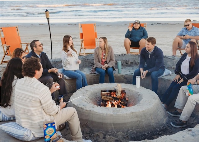 view of home's community featuring an outdoor fire pit