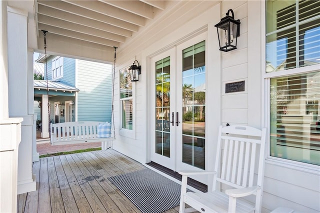 wooden terrace with a porch