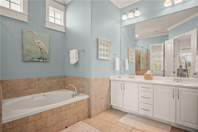 bathroom featuring ornamental molding, tile patterned floors, and plenty of natural light