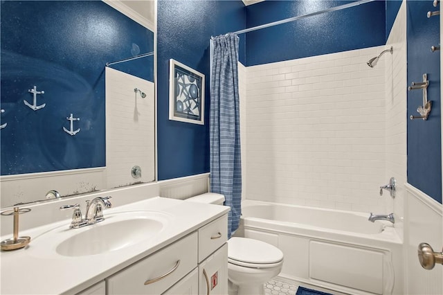 full bathroom featuring vanity, crown molding, shower / bath combo, and toilet