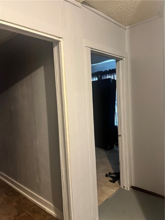 corridor with dark tile patterned flooring