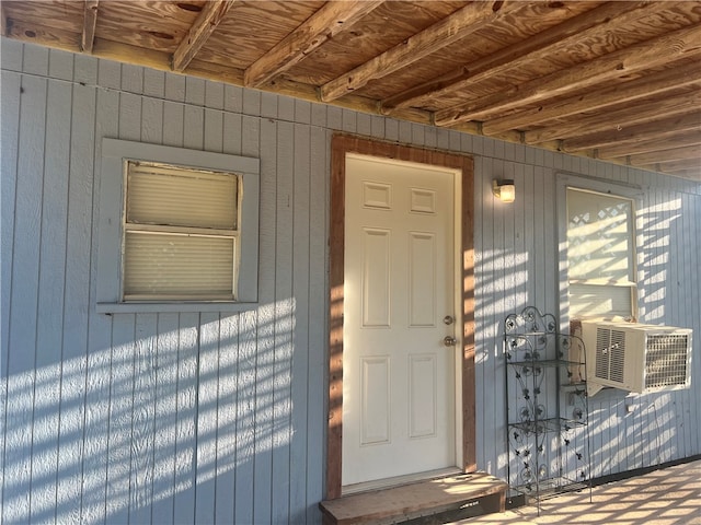 entrance to property featuring cooling unit