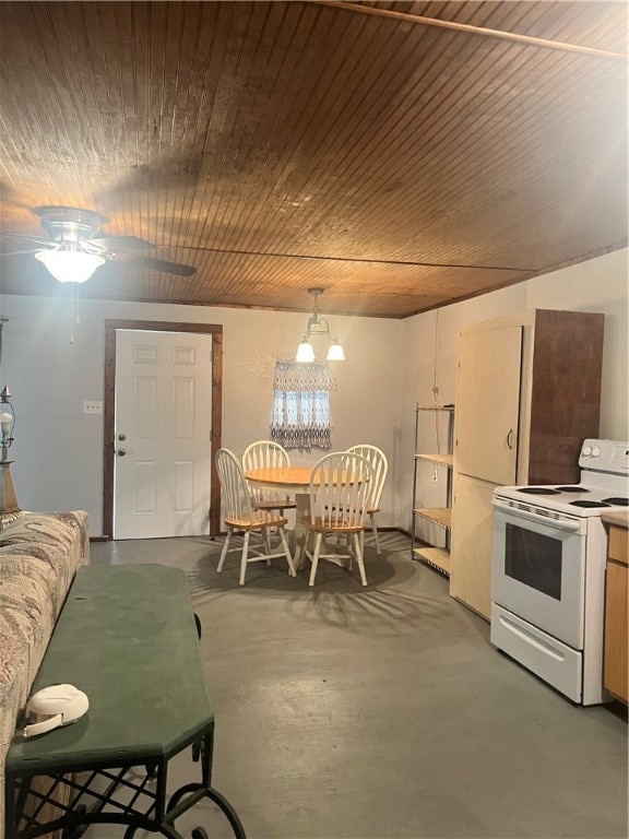 dining room featuring concrete flooring and ceiling fan with notable chandelier