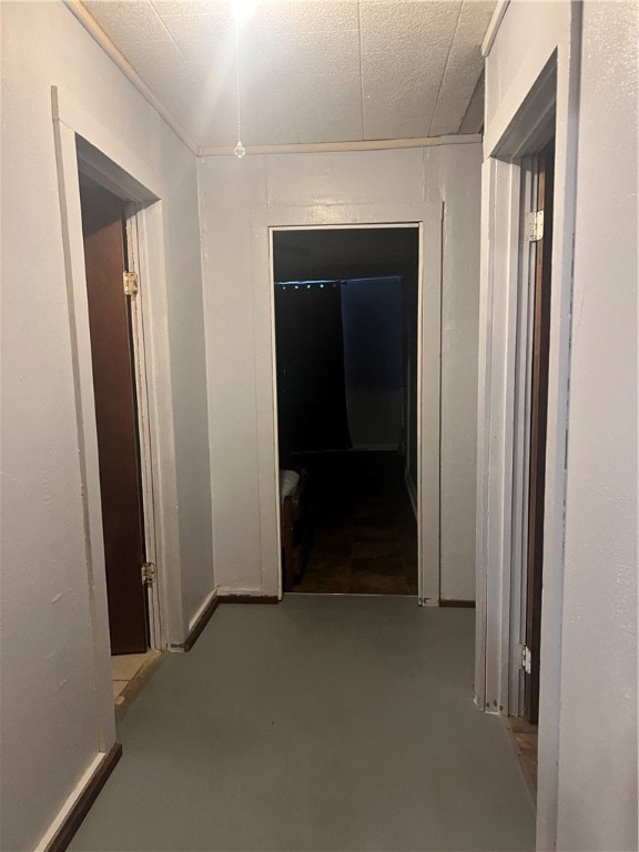 hallway with concrete flooring