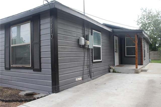 1110 Elgin St, Corpus Christi, TX 78405 - view of side of property featuring a patio area