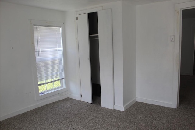 1110 Elgin St, Corpus Christi, TX 78405 - unfurnished bedroom with carpet floors, baseboards, and a closet