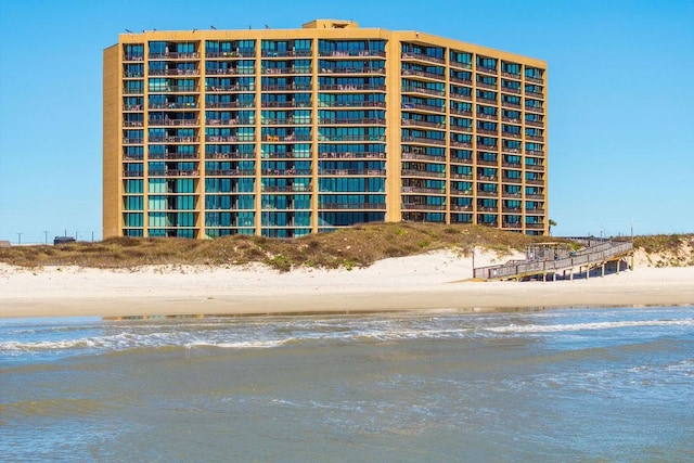 view of building exterior with a water view