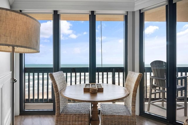 sunroom / solarium with a water view