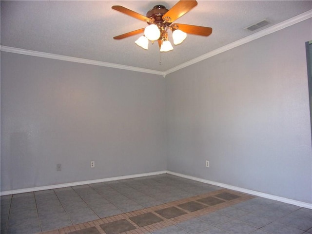 tiled spare room with visible vents, a ceiling fan, crown molding, and baseboards