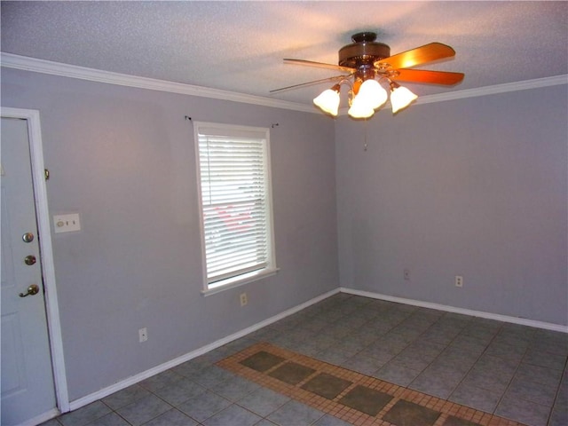 spare room featuring ceiling fan, tile patterned flooring, a textured ceiling, and ornamental molding