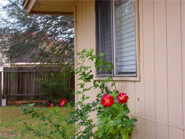 view of home's exterior with fence