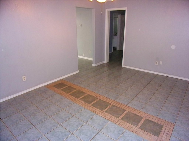 unfurnished room featuring tile patterned flooring and ceiling fan