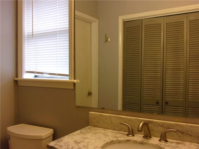 bathroom with vanity and toilet