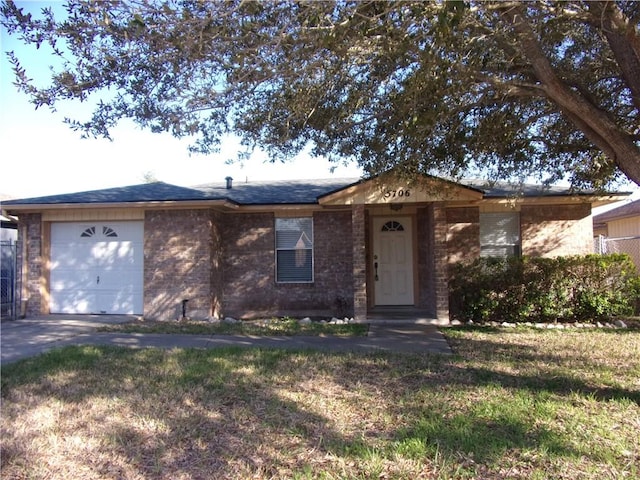 ranch-style home with a front lawn, an attached garage, and a shingled roof