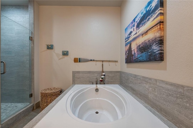 bathroom with shower with separate bathtub