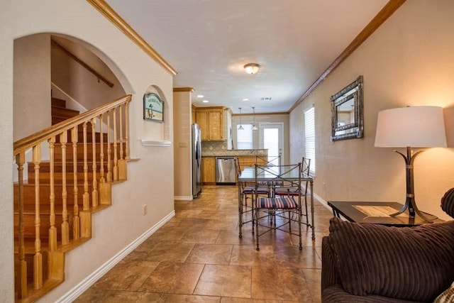 dining space featuring ornamental molding