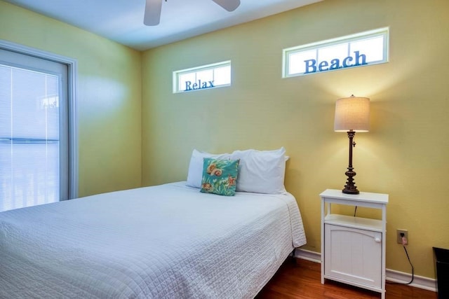 bedroom with ceiling fan and dark hardwood / wood-style floors