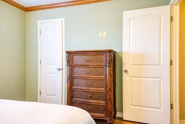 tiled bedroom featuring ornamental molding