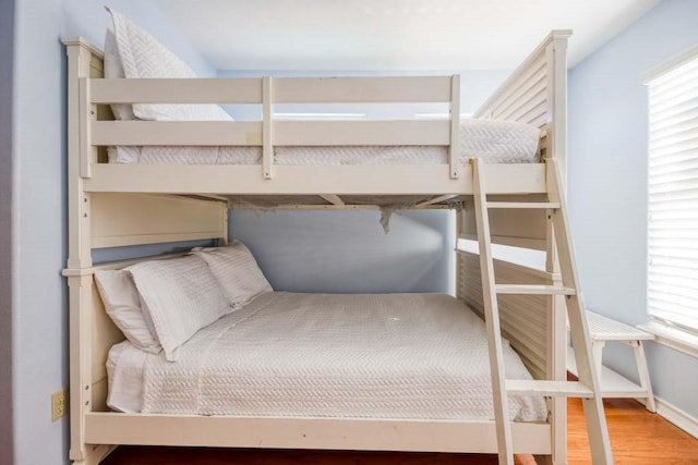 bedroom with hardwood / wood-style floors