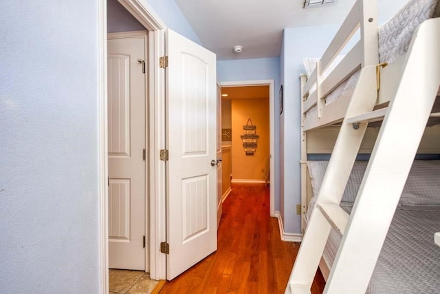 corridor featuring wood-type flooring