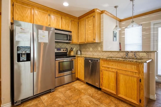 kitchen with hanging light fixtures, sink, crown molding, light stone countertops, and appliances with stainless steel finishes