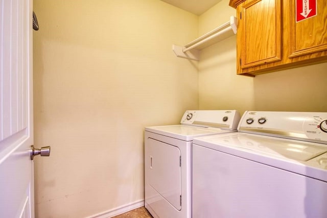 laundry area featuring cabinets and independent washer and dryer