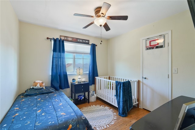 bedroom featuring hardwood / wood-style floors and ceiling fan