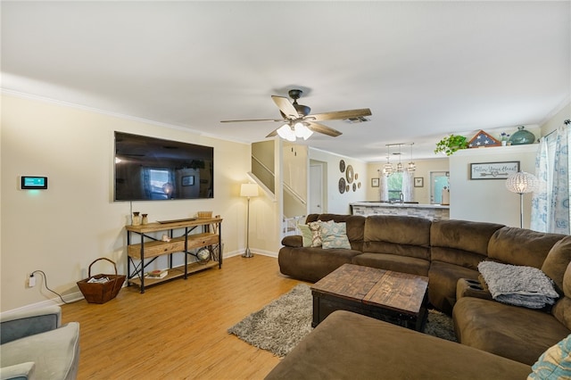 living room with light hardwood / wood-style flooring, ceiling fan, crown molding, and sink