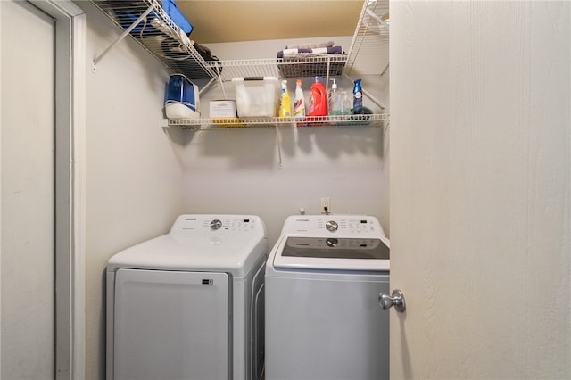 clothes washing area featuring independent washer and dryer