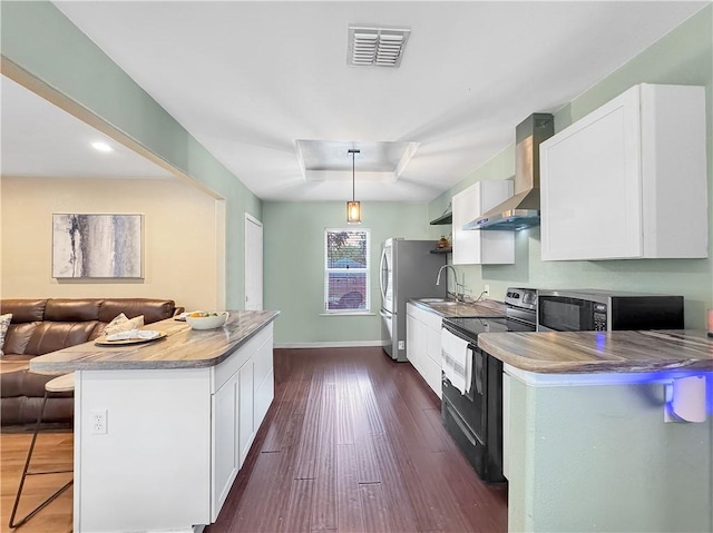 1205 Brentwood Dr, Corpus Christi, TX 78404 - kitchen featuring black electric range oven, wall chimney exhaust hood, white cabinets, dark wood-type flooring, and a breakfast bar area