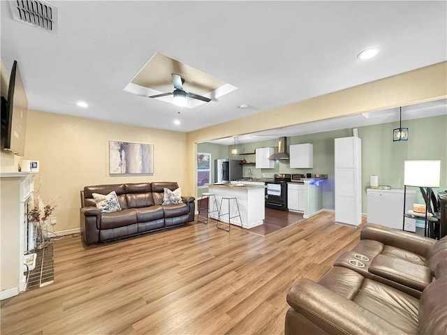 1205 Brentwood Dr, Corpus Christi, TX 78404 - living area with ceiling fan, light wood finished floors, and recessed lighting