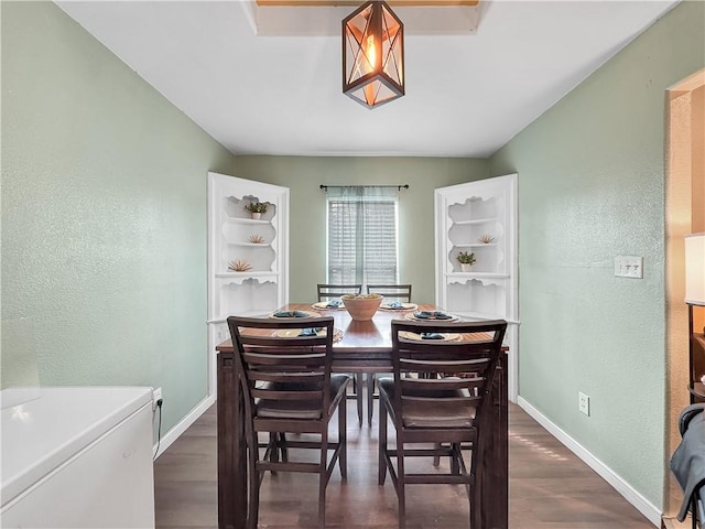 1205 Brentwood Dr, Corpus Christi, TX 78404 - dining space featuring a textured wall and dark wood-style flooring