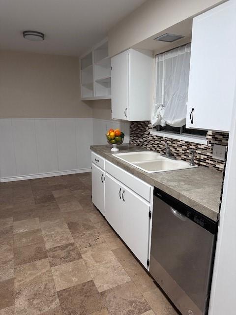 4633 Wilma Dr, Corpus Christi, TX 78412 - kitchen featuring stainless steel dishwasher, a sink, white cabinetry, open shelves, and tasteful backsplash