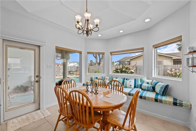 kitchen with a kitchen island, appliances with stainless steel finishes, decorative backsplash, and hanging light fixtures