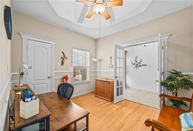 bedroom with sink, connected bathroom, carpet, ceiling fan, and a raised ceiling