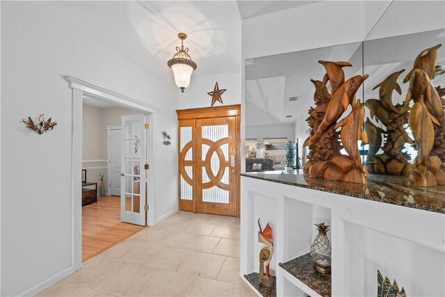 office space featuring french doors, light hardwood / wood-style floors, and ceiling fan