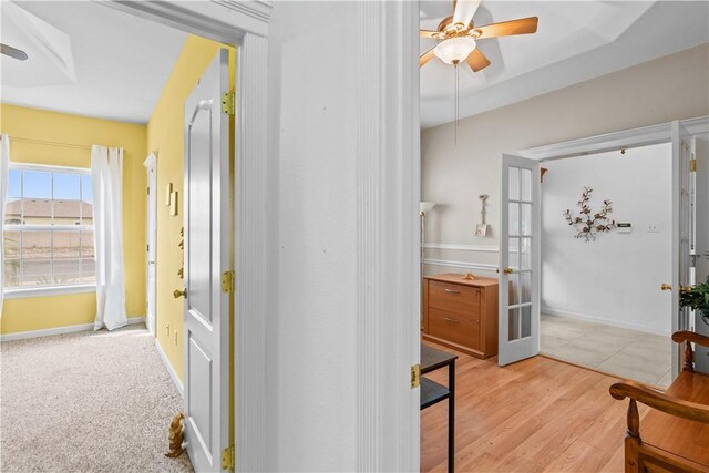 bathroom with tiled bath and tile patterned floors