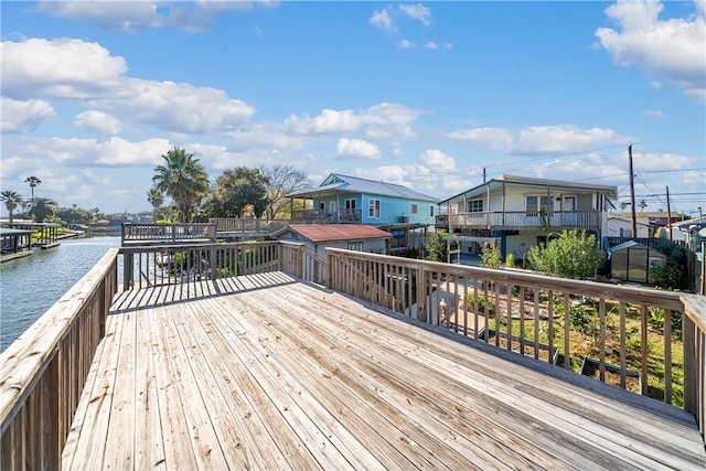 wooden deck with a water view