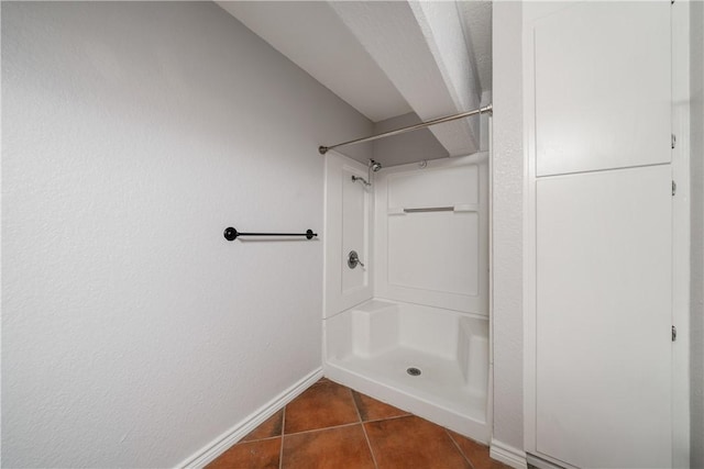 bathroom featuring tile patterned flooring and a shower