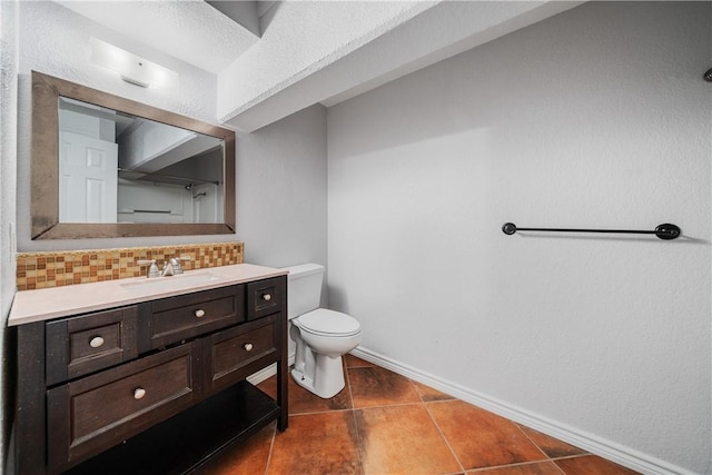 bathroom featuring tile patterned flooring, a textured ceiling, toilet, decorative backsplash, and vanity