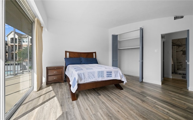 bedroom featuring wood-type flooring