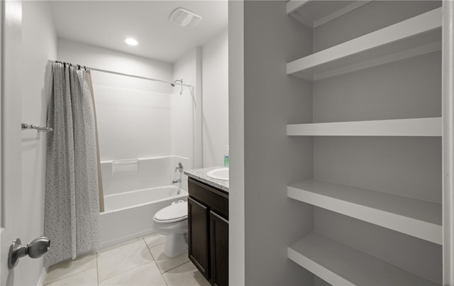 full bathroom featuring toilet, vanity, tile patterned flooring, and shower / bath combo with shower curtain