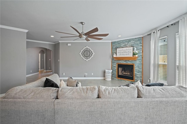 3013 Neches Dr, Corpus Christi, TX 78414 - living area featuring arched walkways, ceiling fan, baseboards, crown molding, and recessed lighting