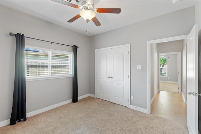 3013 Neches Dr, Corpus Christi, TX 78414 - unfurnished bedroom featuring light colored carpet, baseboards, and a ceiling fan