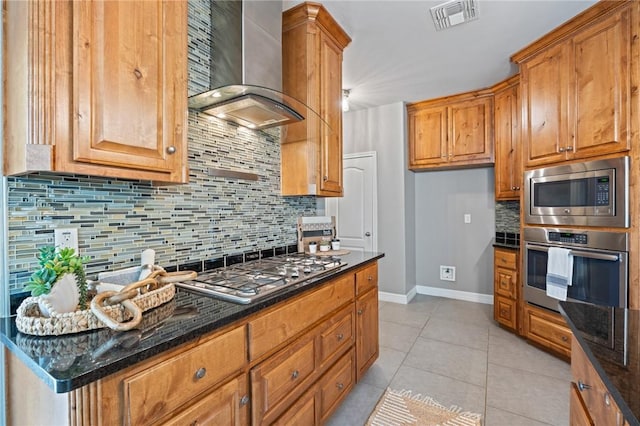 3013 Neches Dr, Corpus Christi, TX 78414 - kitchen with wall chimney exhaust hood, appliances with stainless steel finishes, tasteful backsplash, baseboards, and dark stone counters