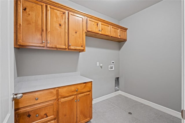 3013 Neches Dr, Corpus Christi, TX 78414 - laundry area with cabinet space, hookup for a gas dryer, hookup for a washing machine, electric dryer hookup, and baseboards