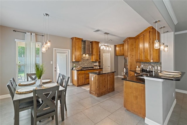 3013 Neches Dr, Corpus Christi, TX 78414 - kitchen with wall chimney exhaust hood, a sink, tasteful backsplash, and brown cabinetry