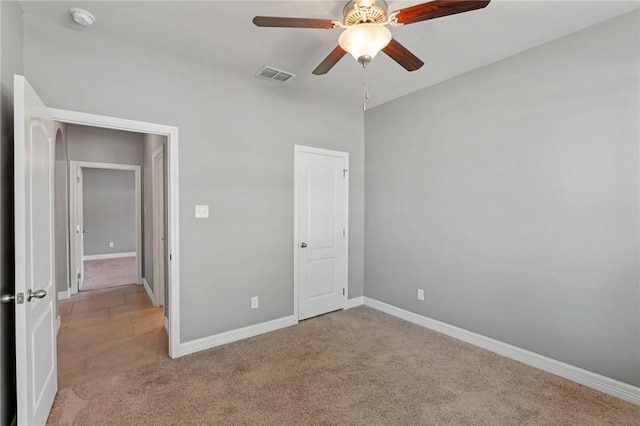 3013 Neches Dr, Corpus Christi, TX 78414 - unfurnished bedroom with light carpet, baseboards, and a ceiling fan