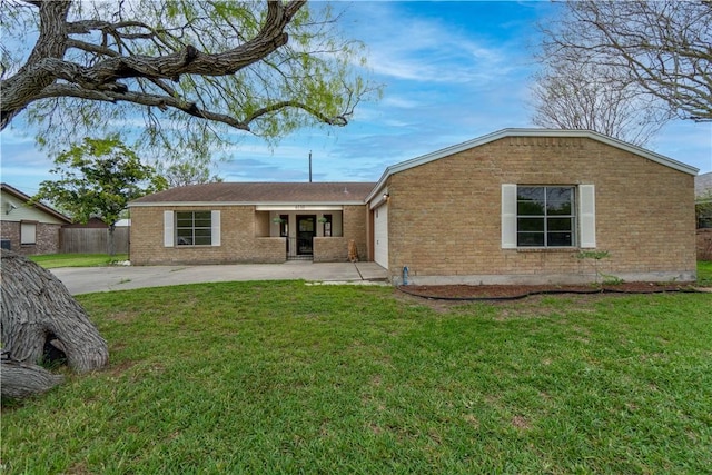 back of property featuring a lawn